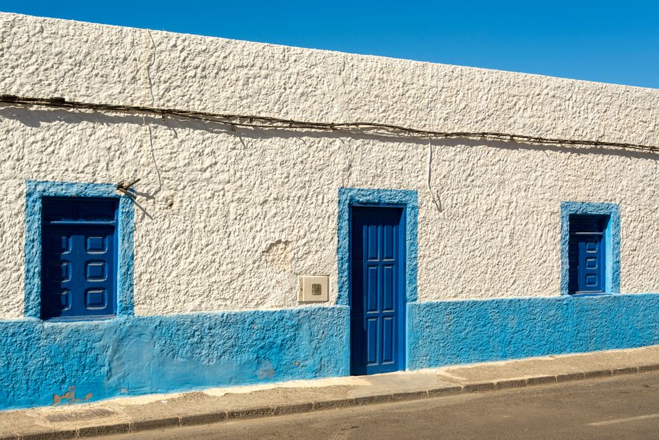 Blue and white painted house front.